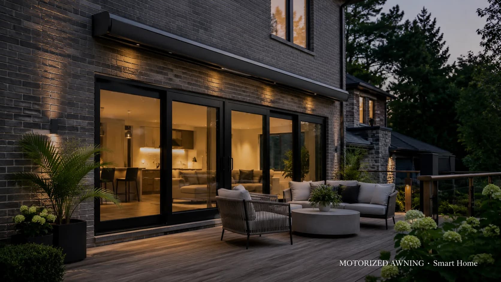 Motorized awning on a modern home at dusk